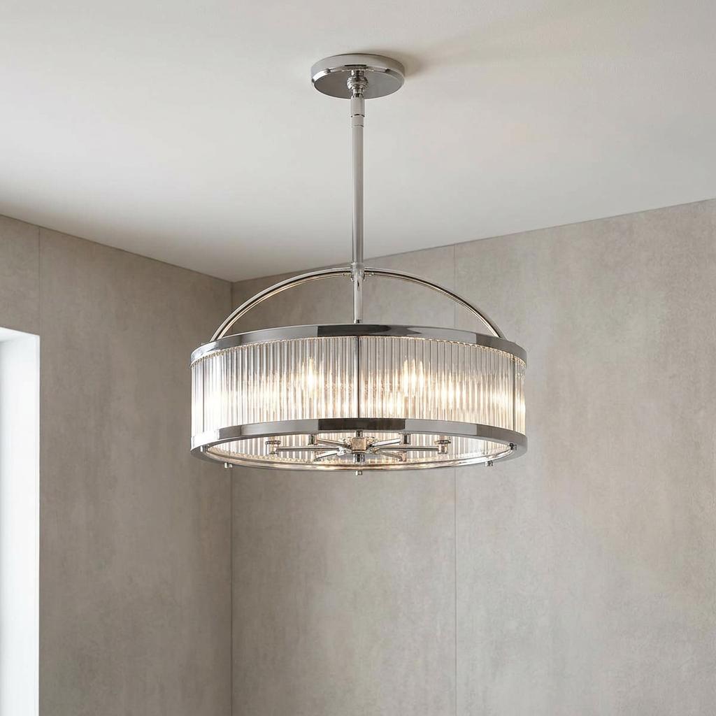 Feiss Paulson 6-light chrome pendant with ribbed glass rods hanging in a modern tiled bathroom.