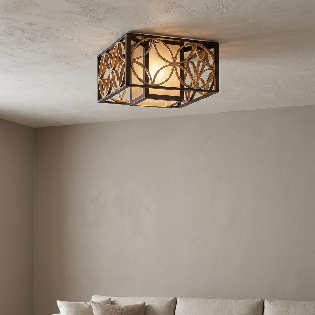 Square Art Deco flush ceiling light with bronze frames and gold circular patterns, illuminated in a neutral room.