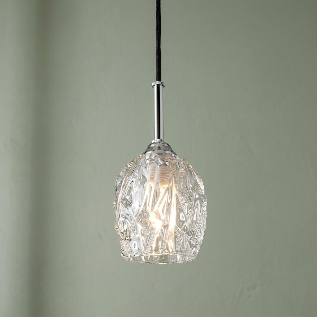 Feiss Rubin 1-light mini pendant in polished nickel with a textured clear glass shade against a sage green wall.