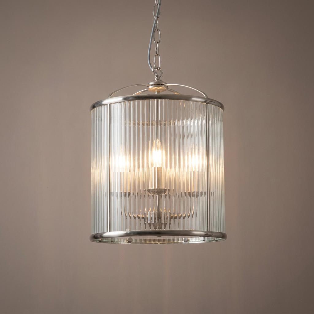 Fern antique chrome 4-light hallway pendant with a fluted glass cylindrical shade hanging against a neutral wall.