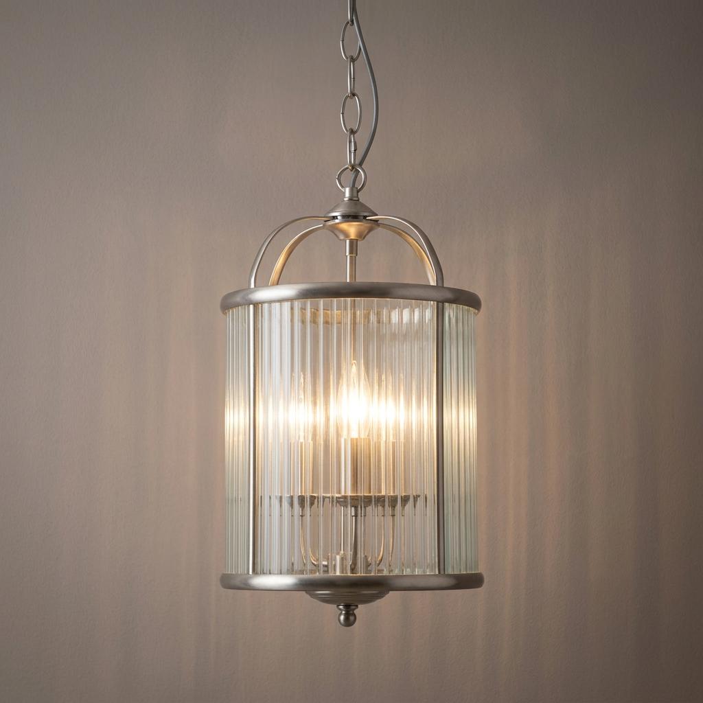Fern antique chrome hallway ceiling light with a ribbed glass cylindrical shade hanging against a plain wall.