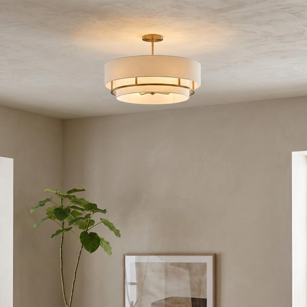 Graham 4 Light Brass Semi Flush light with a white fabric double drum shade in a modern living room setting.