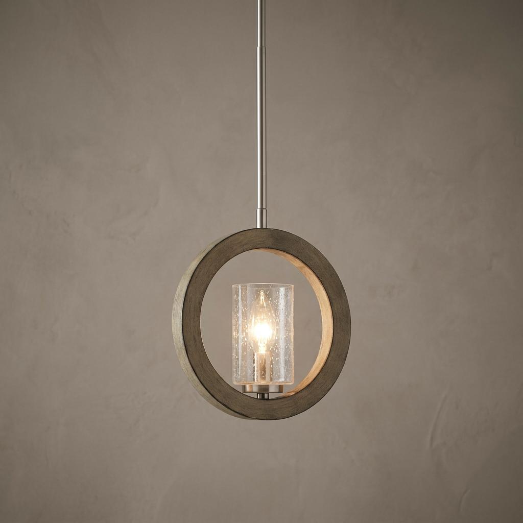 Grand Bank mini pendant light with a circular wood frame and seeded glass cylinder shade against a neutral wall.