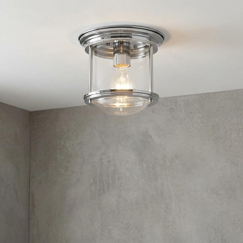 Hadrian flush mount bathroom ceiling light with clear glass and chrome finish on a white ceiling.