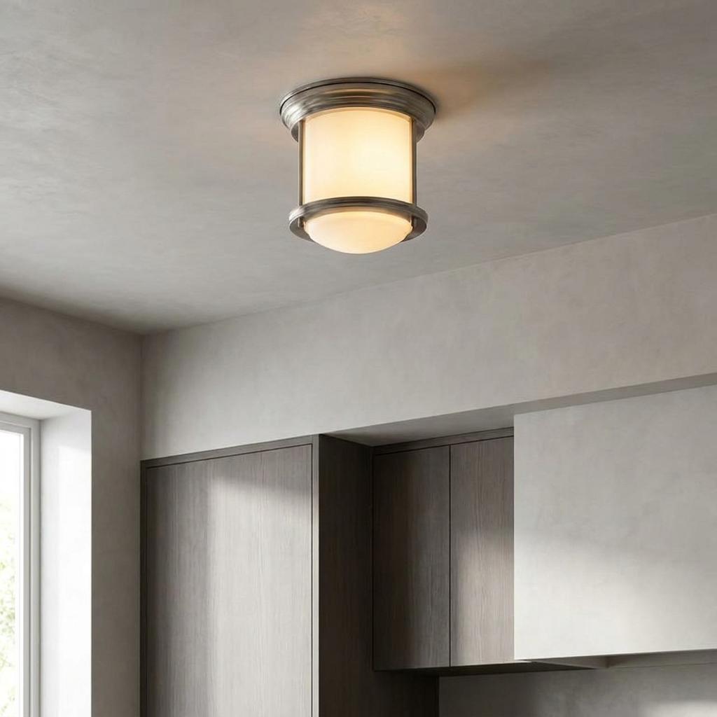 Hadrian flush ceiling light with opal glass and antique nickel finish mounted on a neutral-toned ceiling.