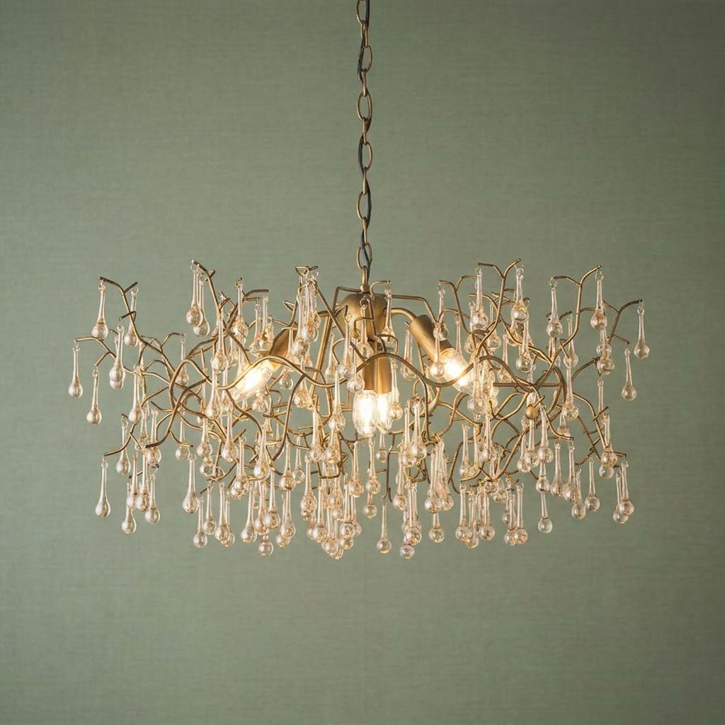 Hampshire 4-light gold pendant with glass teardrops and a branch-like frame against a sage green background.