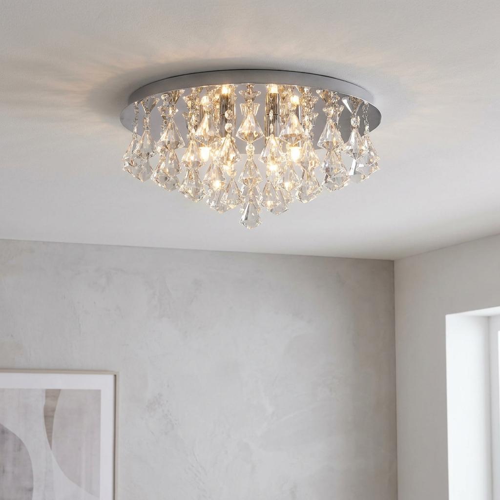 Hanna 6 Light Pyramid Crystal and Chrome Flush Ceiling Light glowing in a modern neutral room.