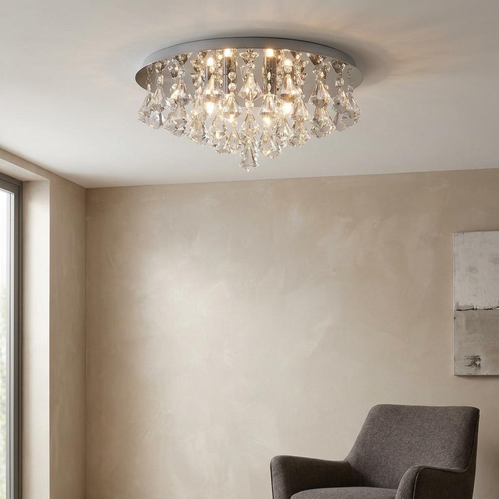 Crystal pyramid flush ceiling light on a chrome base, glowing in a room with a gray chair.
