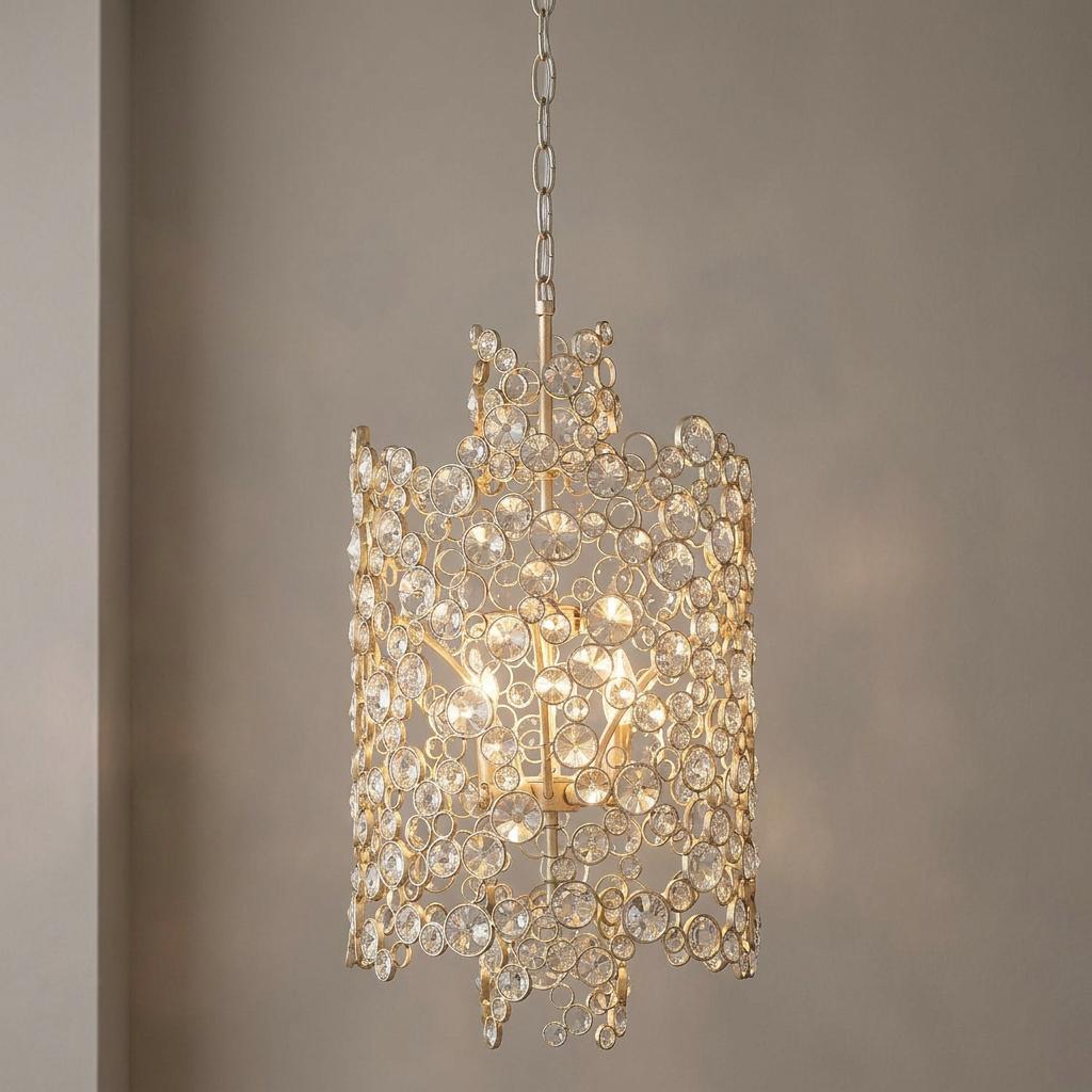 Hinkley Anya two-tier silver pendant light with faceted crystals glowing against a neutral background.