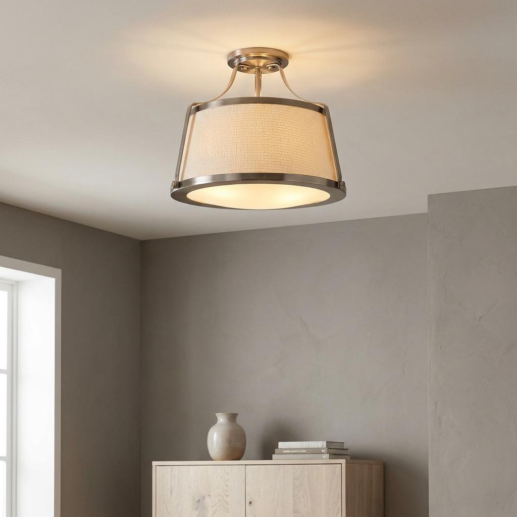 Hinkley Charlotte semi-flush ceiling light with antique nickel finish and linen drum shade in a modern room.