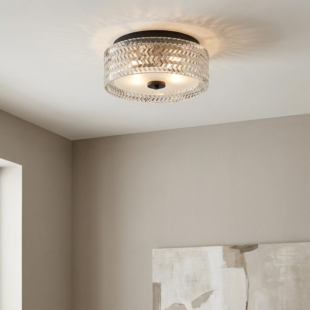 Hinkley Elle black flush ceiling light with a chevron-patterned glass shade in a modern, neutral living space.
