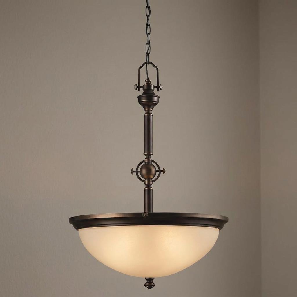 Hinkley Mayflower inverted ceiling pendant with a bronze finish and an amber-tinted etched glass bowl shade.