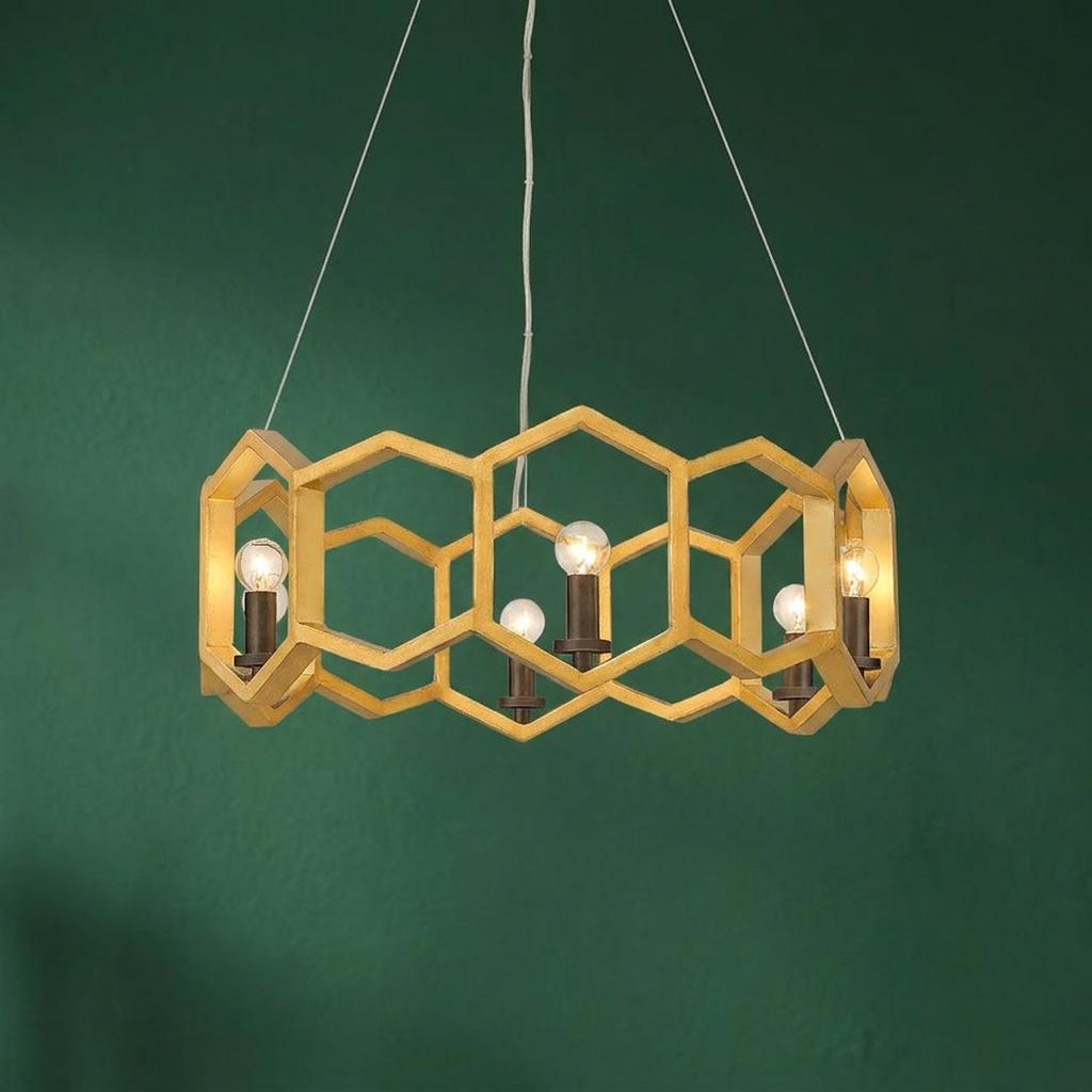 Hinkley Moxie 6-light gold pendant featuring a geometric honeycomb frame against a dark green wall.