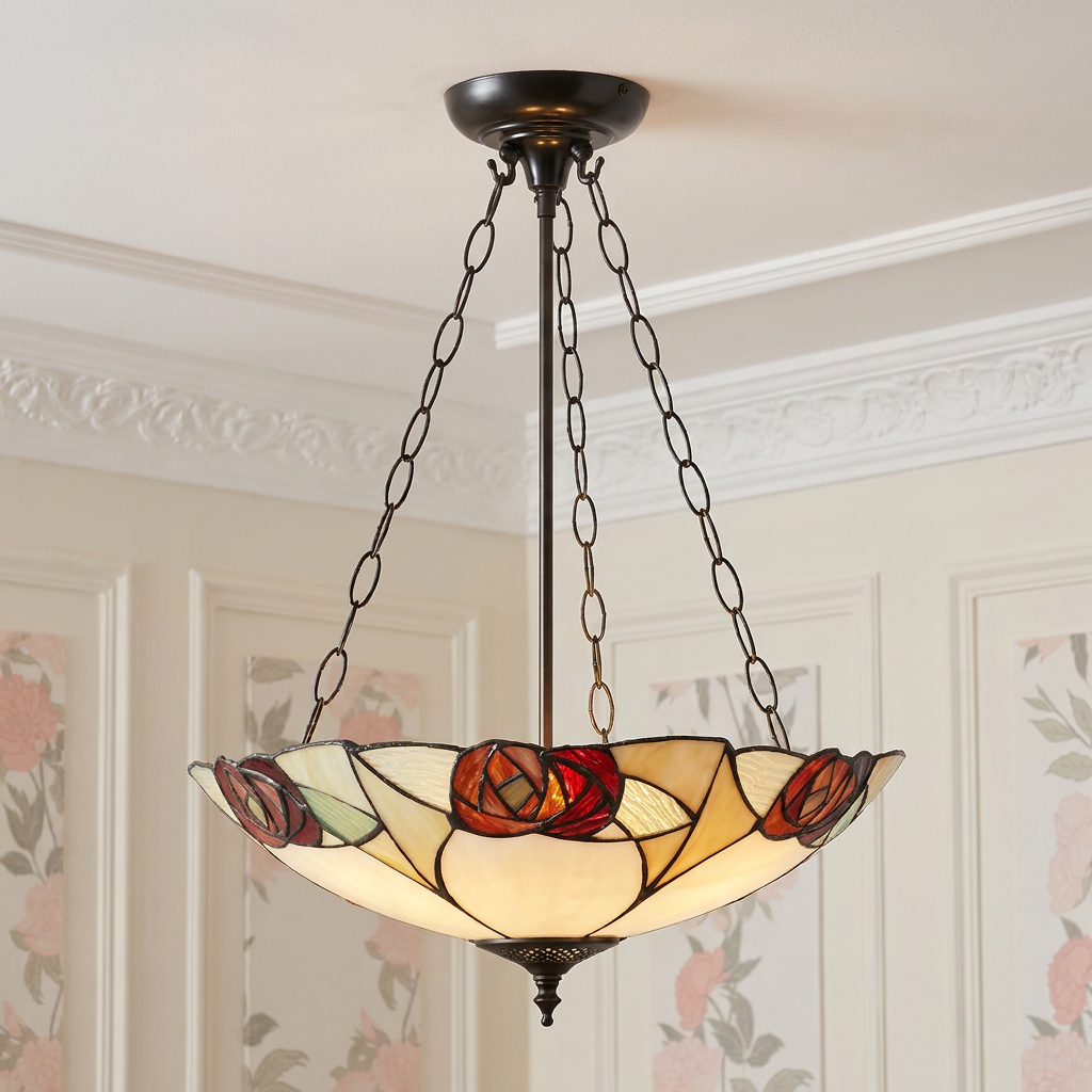 Inverted Tiffany ceiling light with a red rose and cream stained-glass design suspended by dark chains.