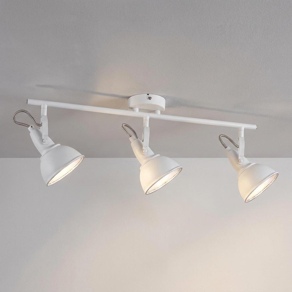 White three-light bar spotlight fixture with adjustable heads mounted on a neutral ceiling.