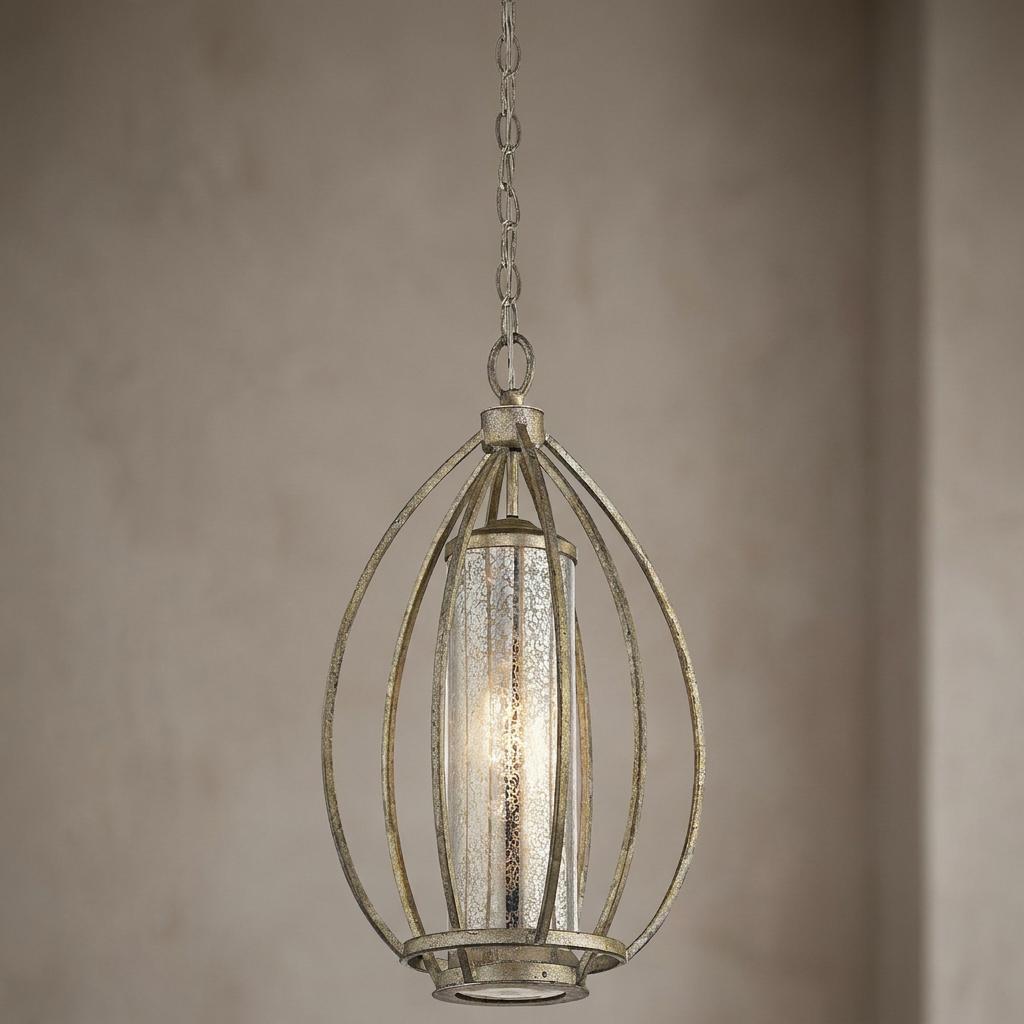 Kichler Rosalie one-light gold pendant with an oval cage and mercury glass shade against a neutral wall.