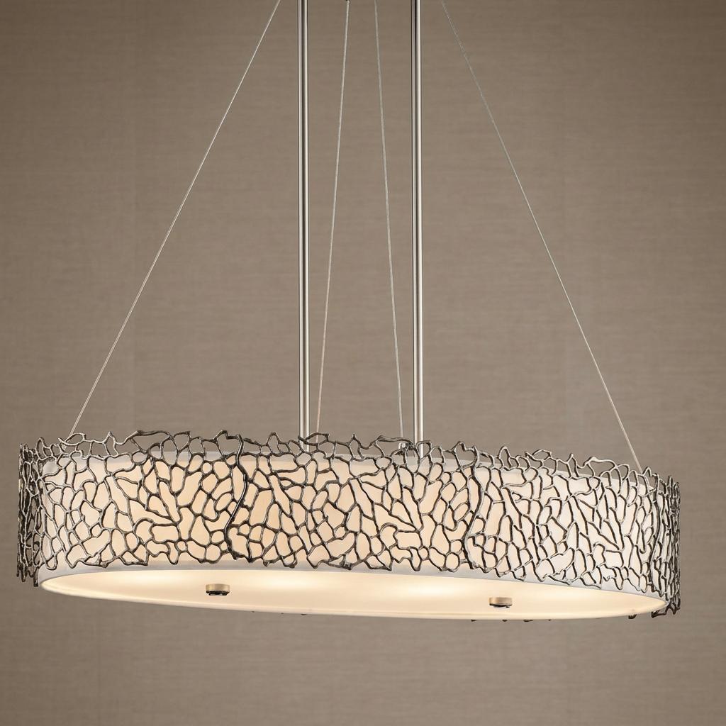 Oval island pendant light featuring silver coral-inspired metal fretwork over a white internal shade.