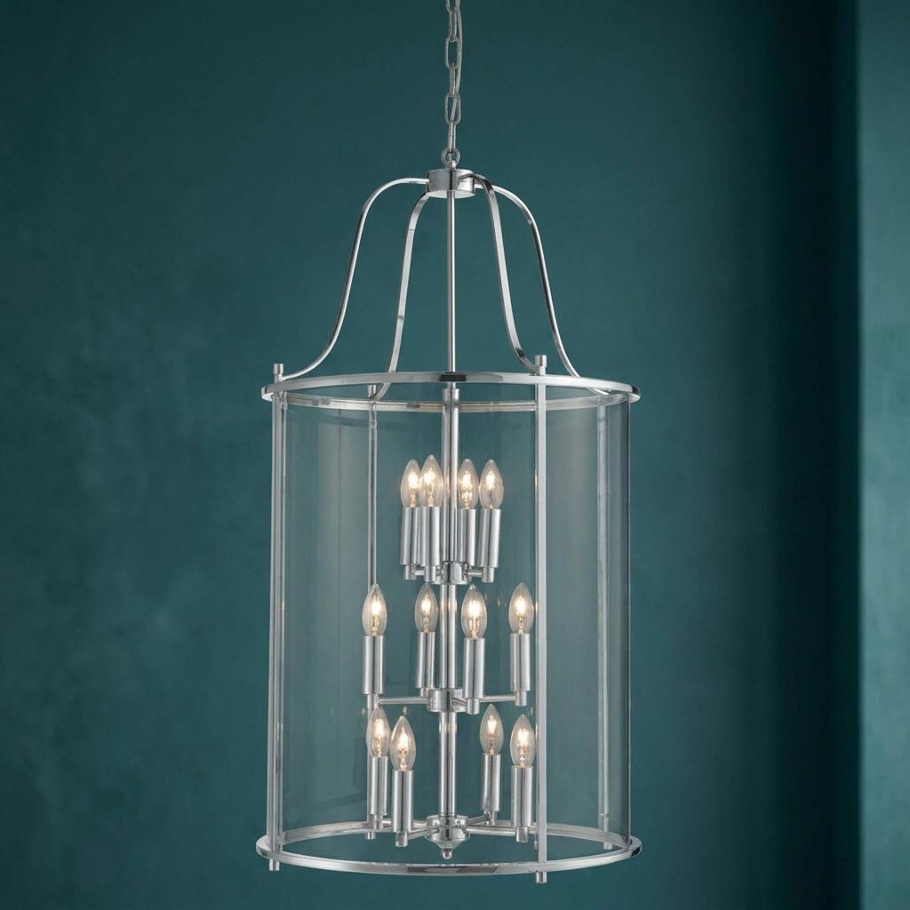A 12-light chrome and clear glass cylinder lantern pendant hanging against a deep teal textured wall.