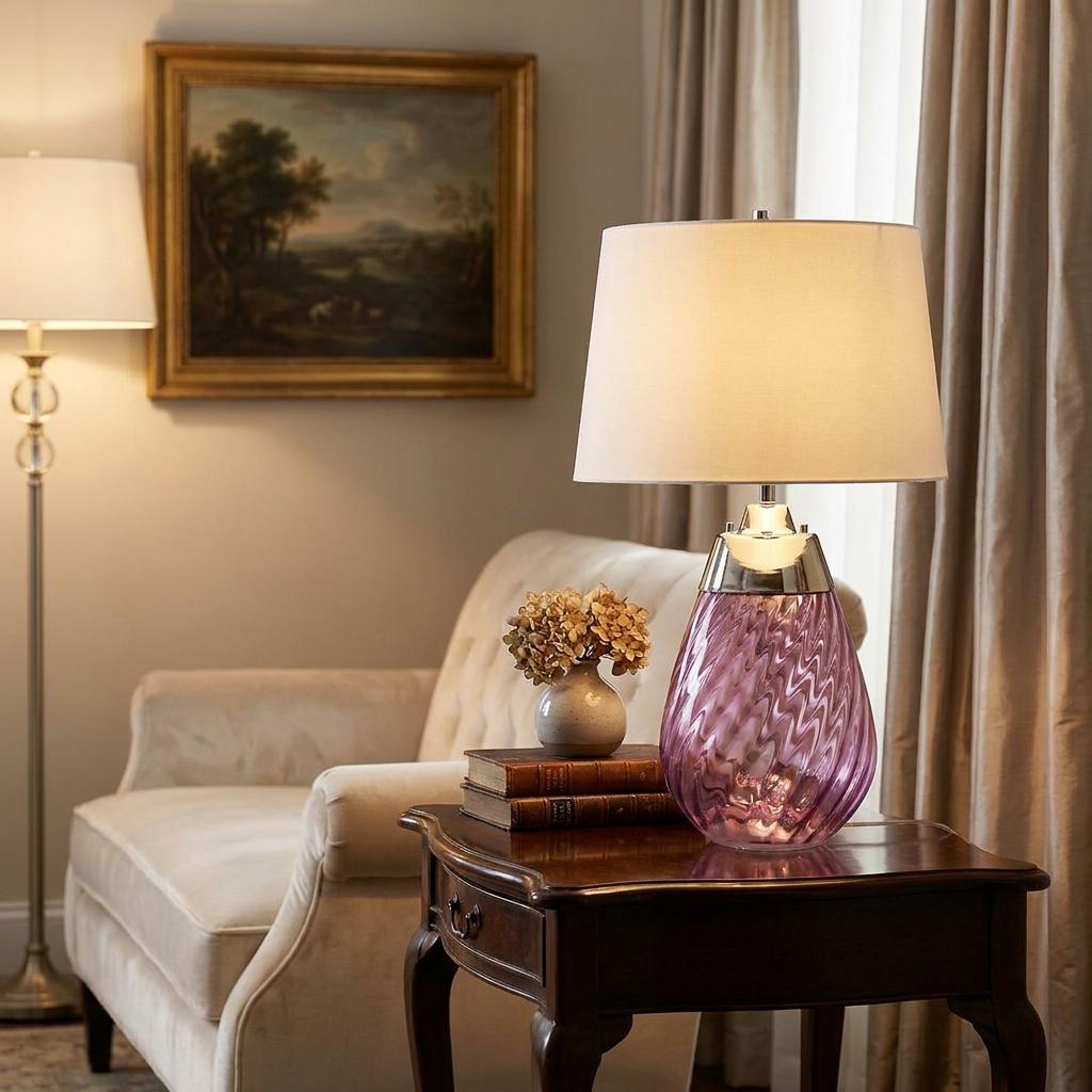 Lena table lamp with a plum rippled glass base and off-white shade on a side table in a warm living room.