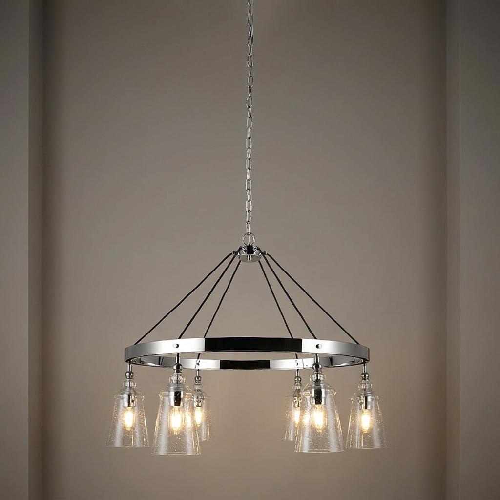 A circular chrome chandelier featuring six seeded glass bell shades suspended by a chain and cables.