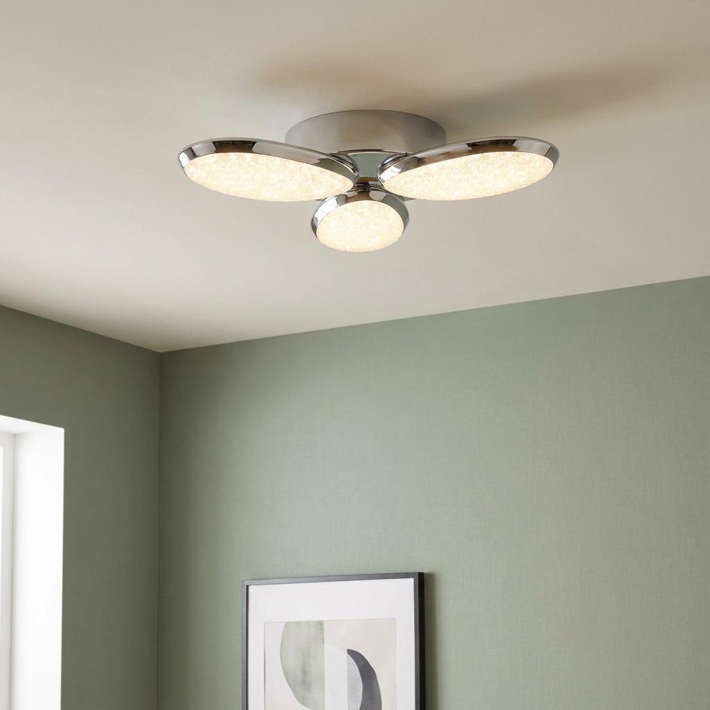 Lori 3 Light LED chrome flush ceiling light with crushed ice effect diffusers in a living room.