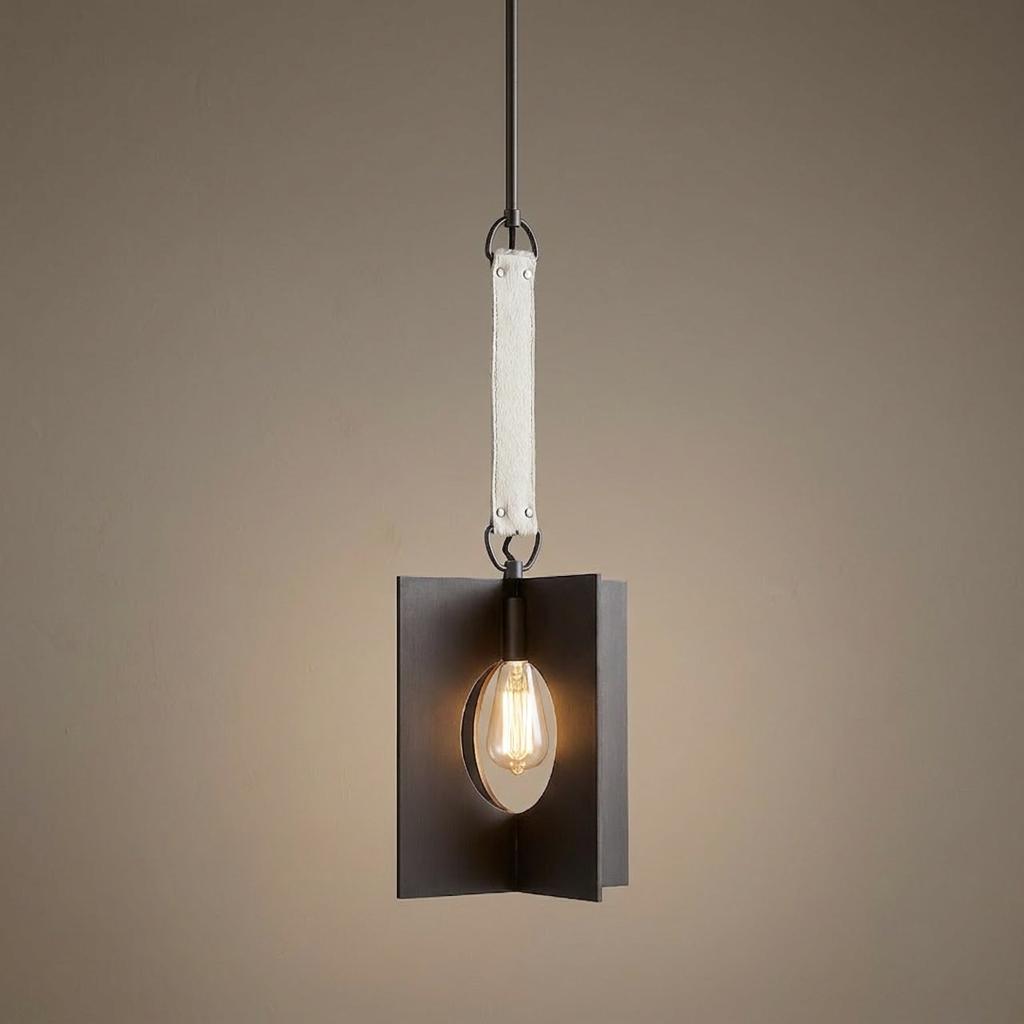 Modern brushed graphite pendant light with white leather strap and a glowing Edison bulb.