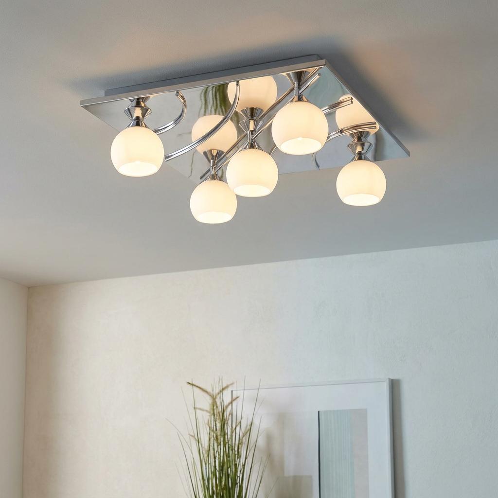 Modern chrome semi-flush ceiling light with five frosted glass globes on a square mirrored base.