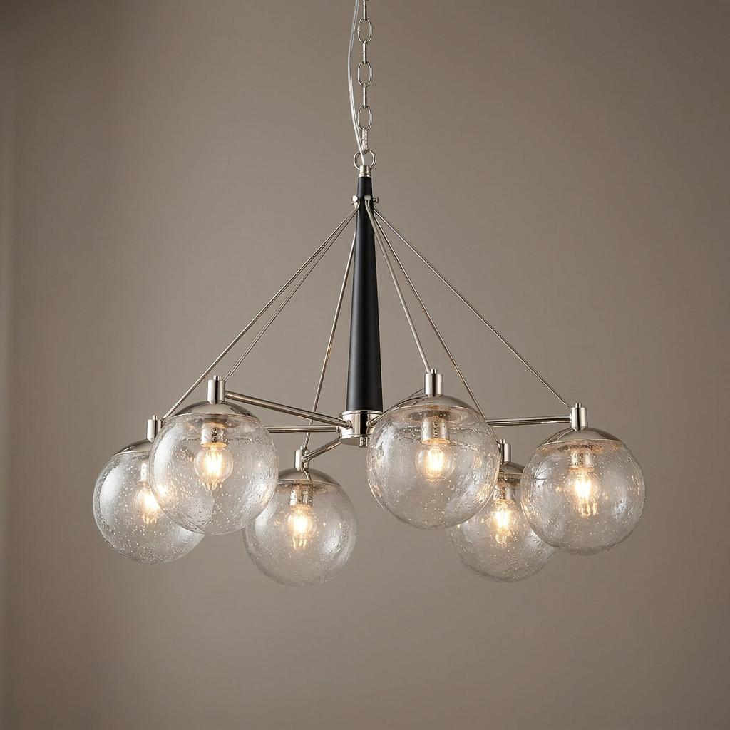 Modern six-light chandelier with polished nickel arms, seeded glass globes, and a tapered black central spindle.
