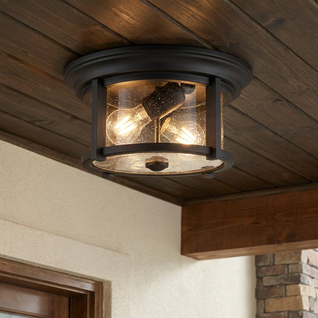 Merrill 2-light outdoor flush mount fixture with seeded glass and warm bulbs on a dark wood ceiling.