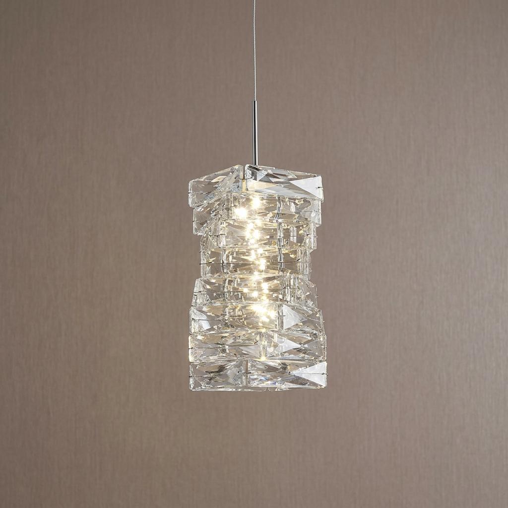 A Modena LED pendant light with tiered crystal glass blocks and chrome accents against a neutral wall.