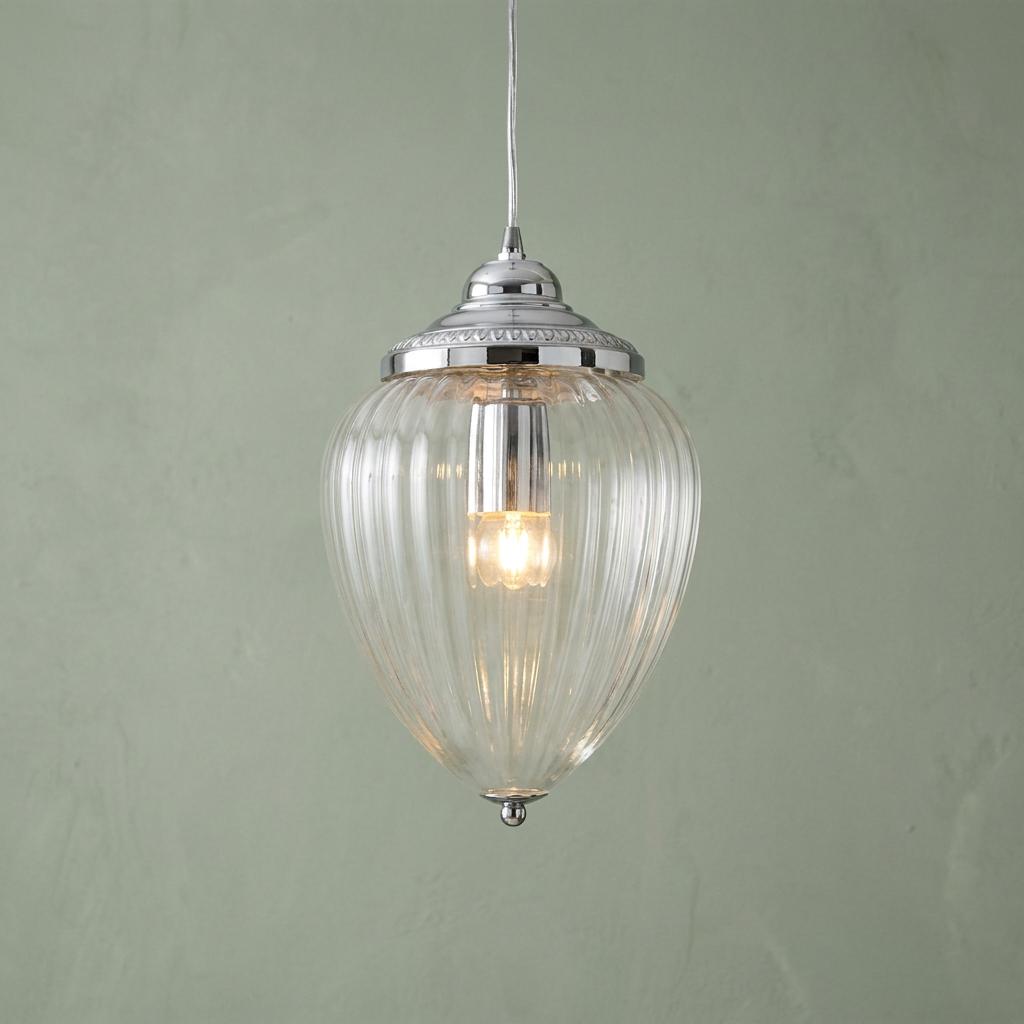 Moscow chrome pendant light with clear ribbed glass shade lit against a pale green textured wall.