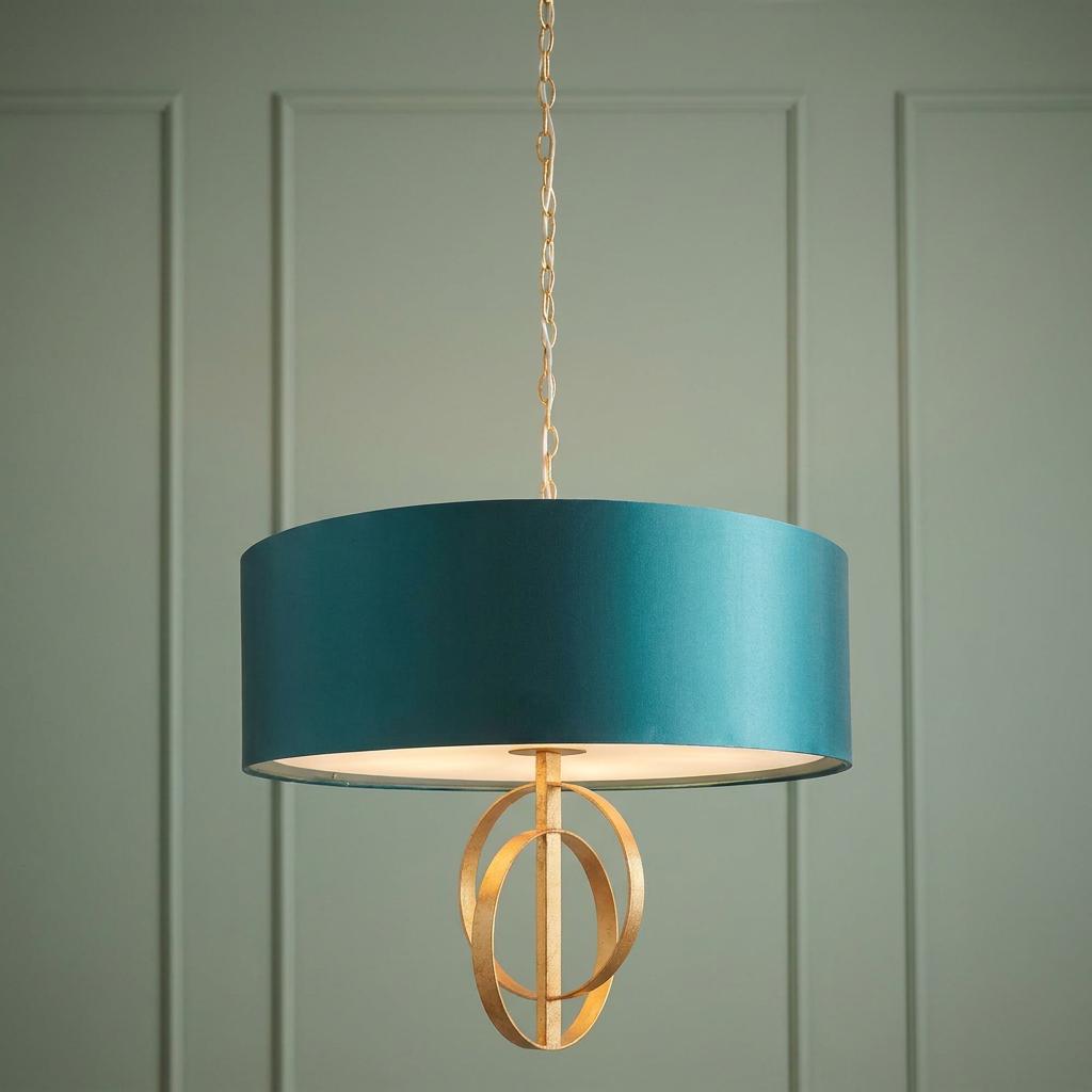 Norfolk XL 5-light gold leaf pendant with a teal drum shade and interlocking circle finial against a green wall.