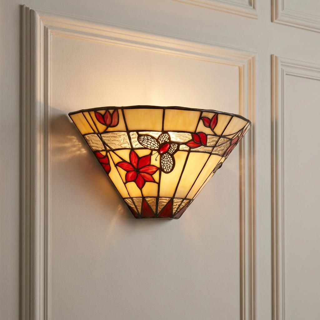 Tiffany-style wall sconce with red butterfly and floral stained glass mounted on a white paneled wall.
