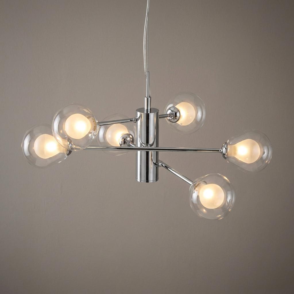 Oaks Harren 6 light chrome ceiling pendant with clear glass globe shades and warm glowing bulbs.