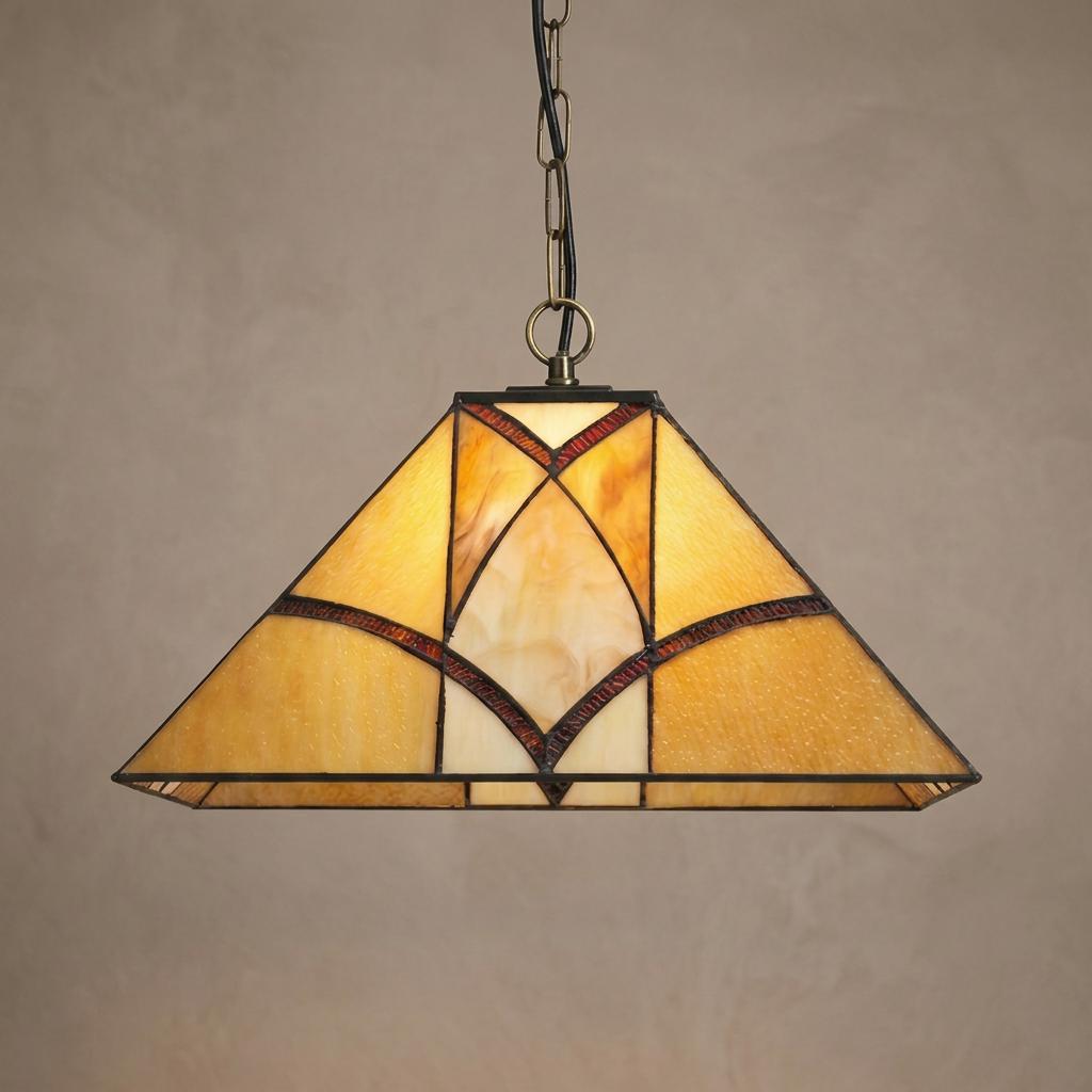 Trapezoidal Tiffany-style pendant light with amber glass and dark geometric patterns hanging from a chain.