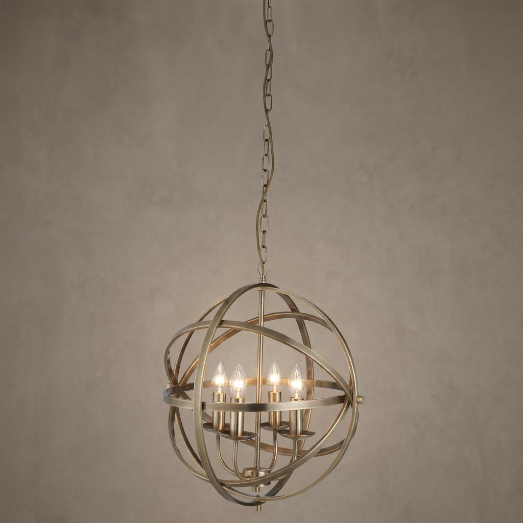 Brass 4-light orbit cage pendant with an interlocking orb design hanging against a neutral wall.
