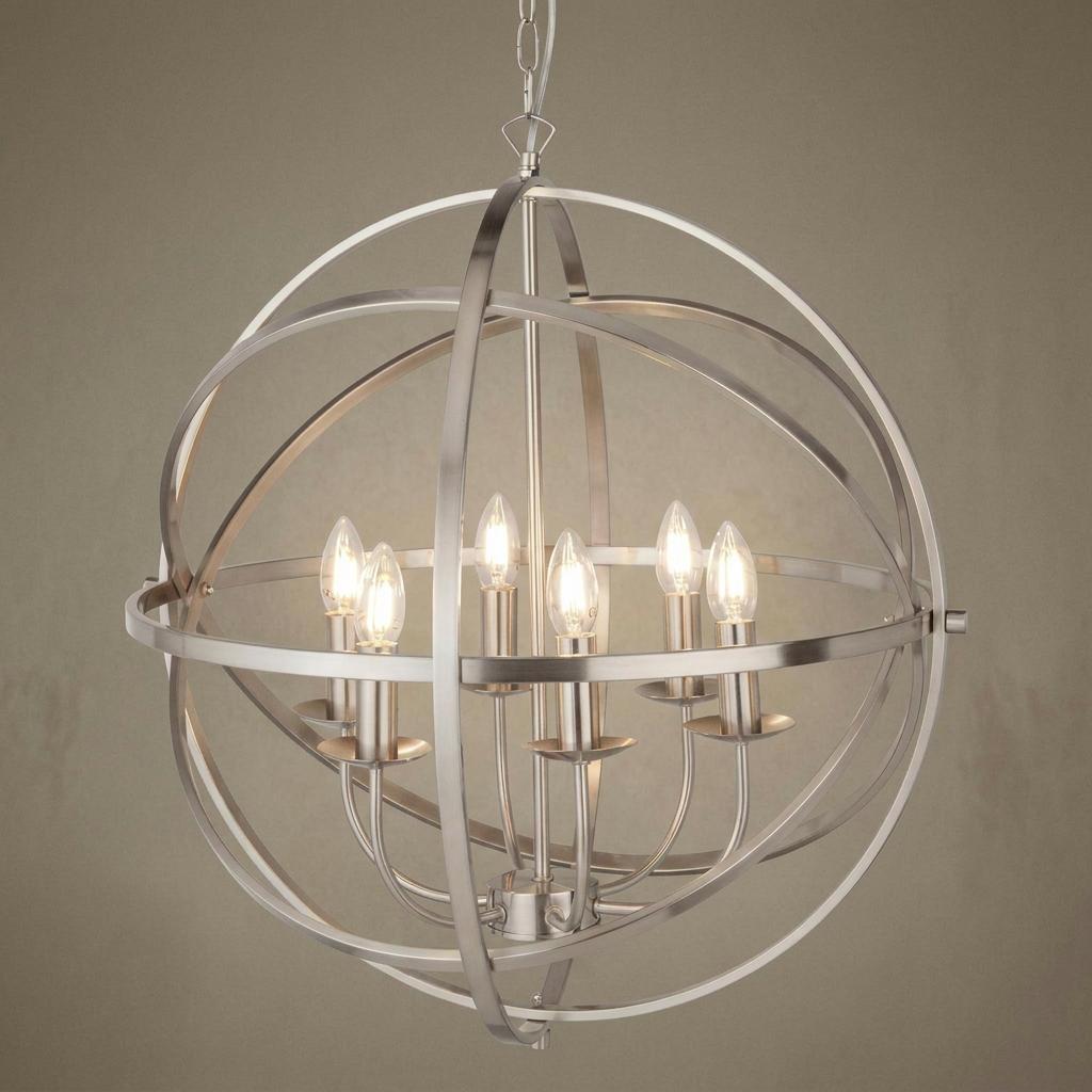 A six-light silver orb pendant featuring an open cage frame and lit candle-style bulbs.