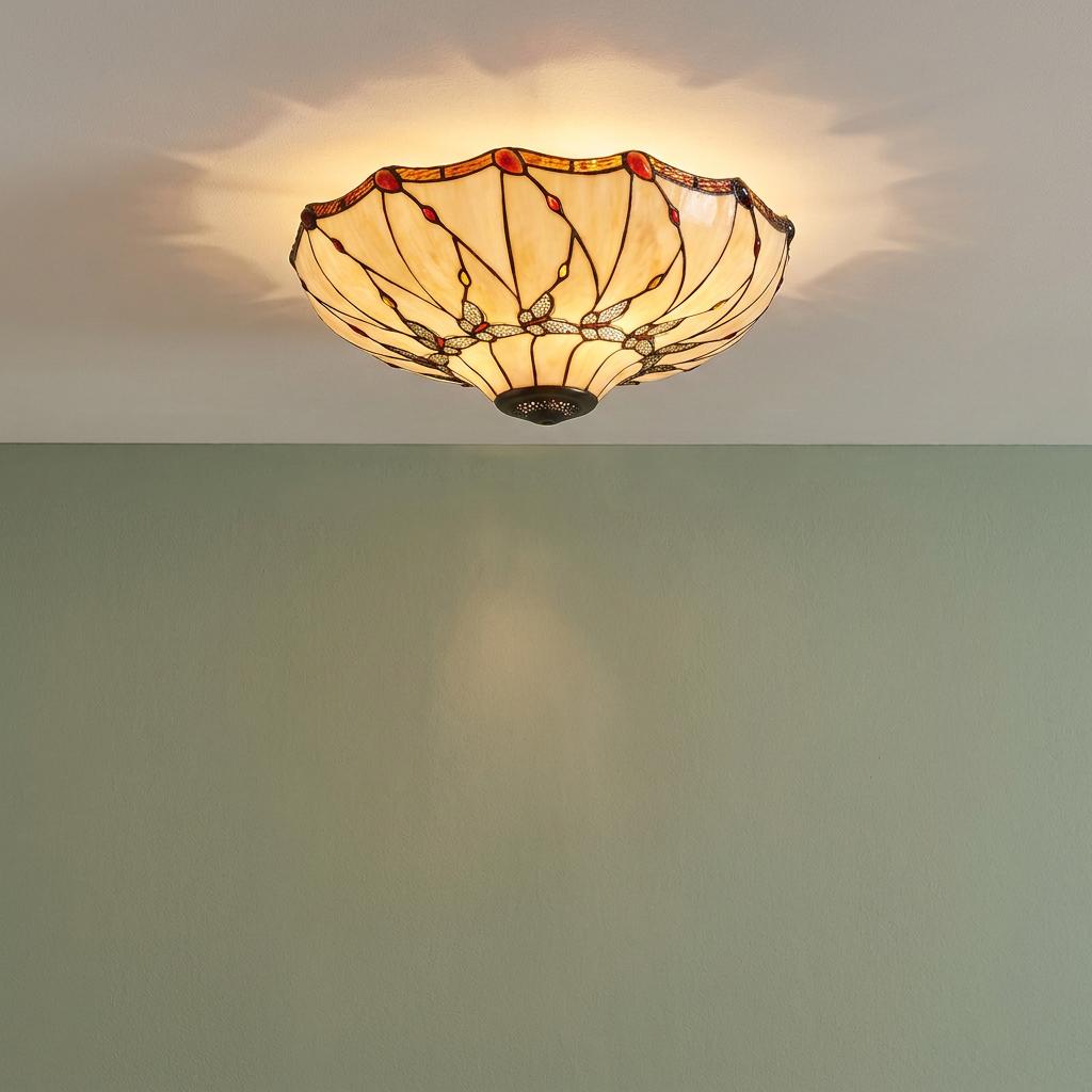 Papillon Large Flush Tiffany Ceiling Light featuring an amber and red stained glass dragonfly design on a sage wall.