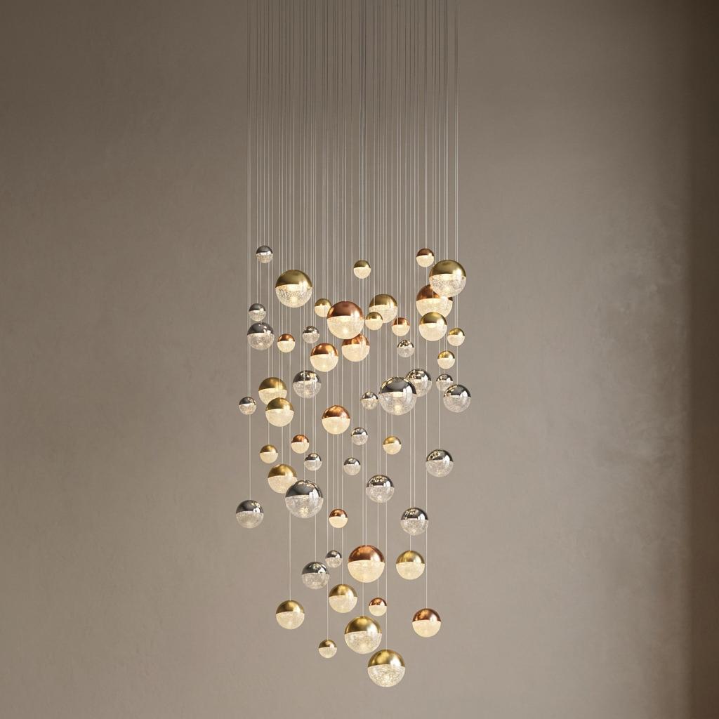55-light multi-drop LED pendant featuring chrome, copper, and brass metallic glass spheres at staggered heights.