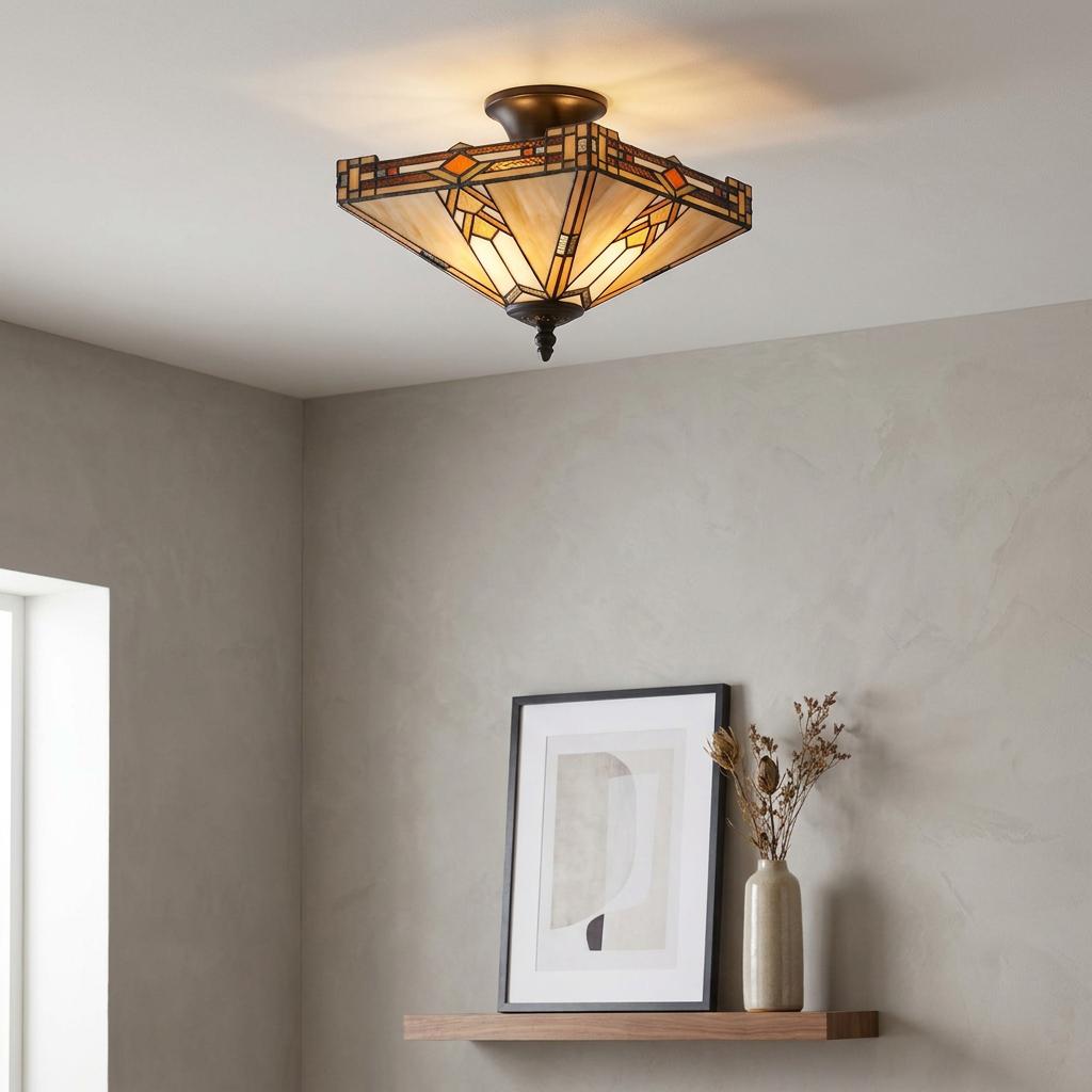 Geometric Prairie-style Tiffany semi-flush ceiling light with amber stained glass illuminating a neutral modern room.