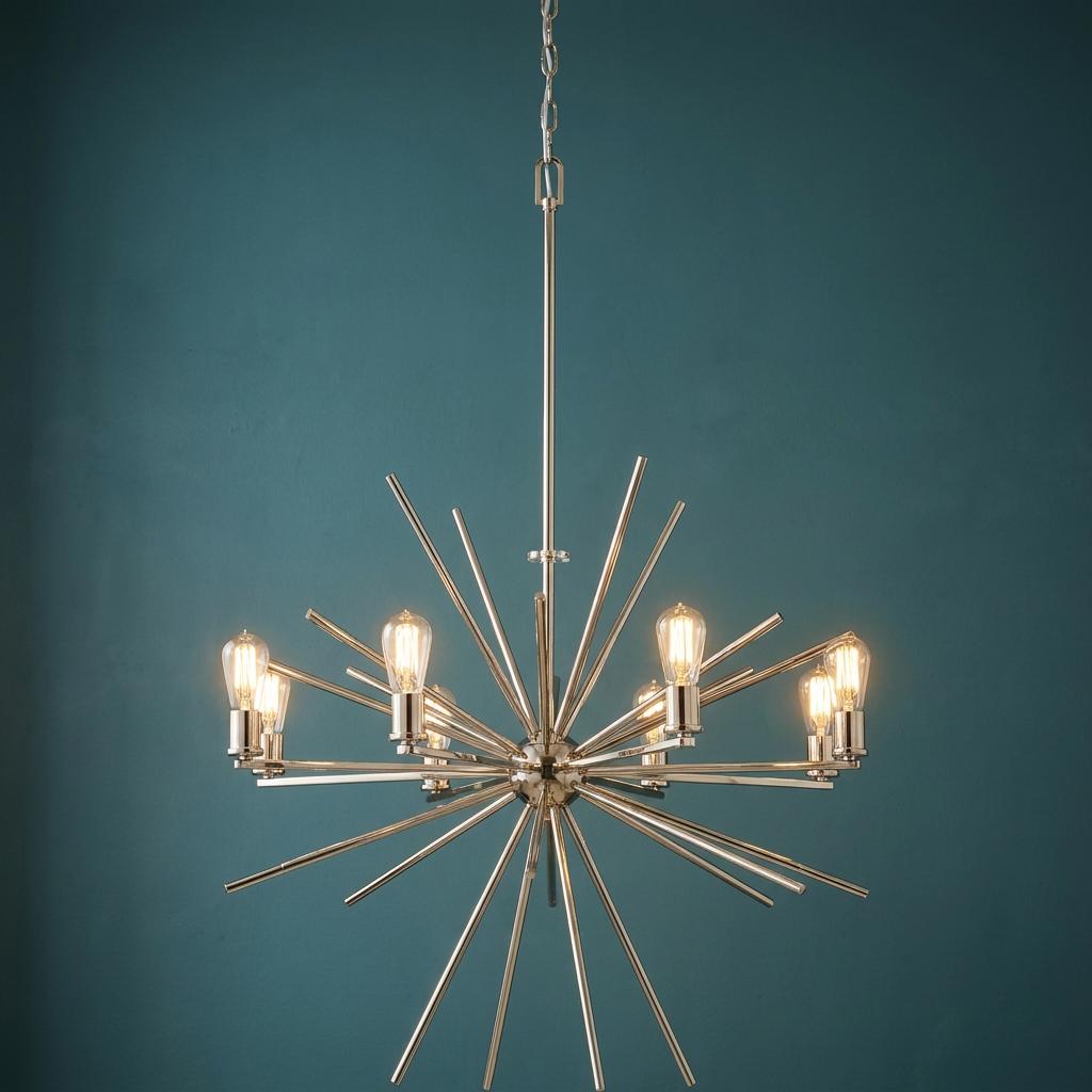 Quoizel Carnegie 8-light starburst chandelier in imperial silver with exposed bulbs against a teal wall.
