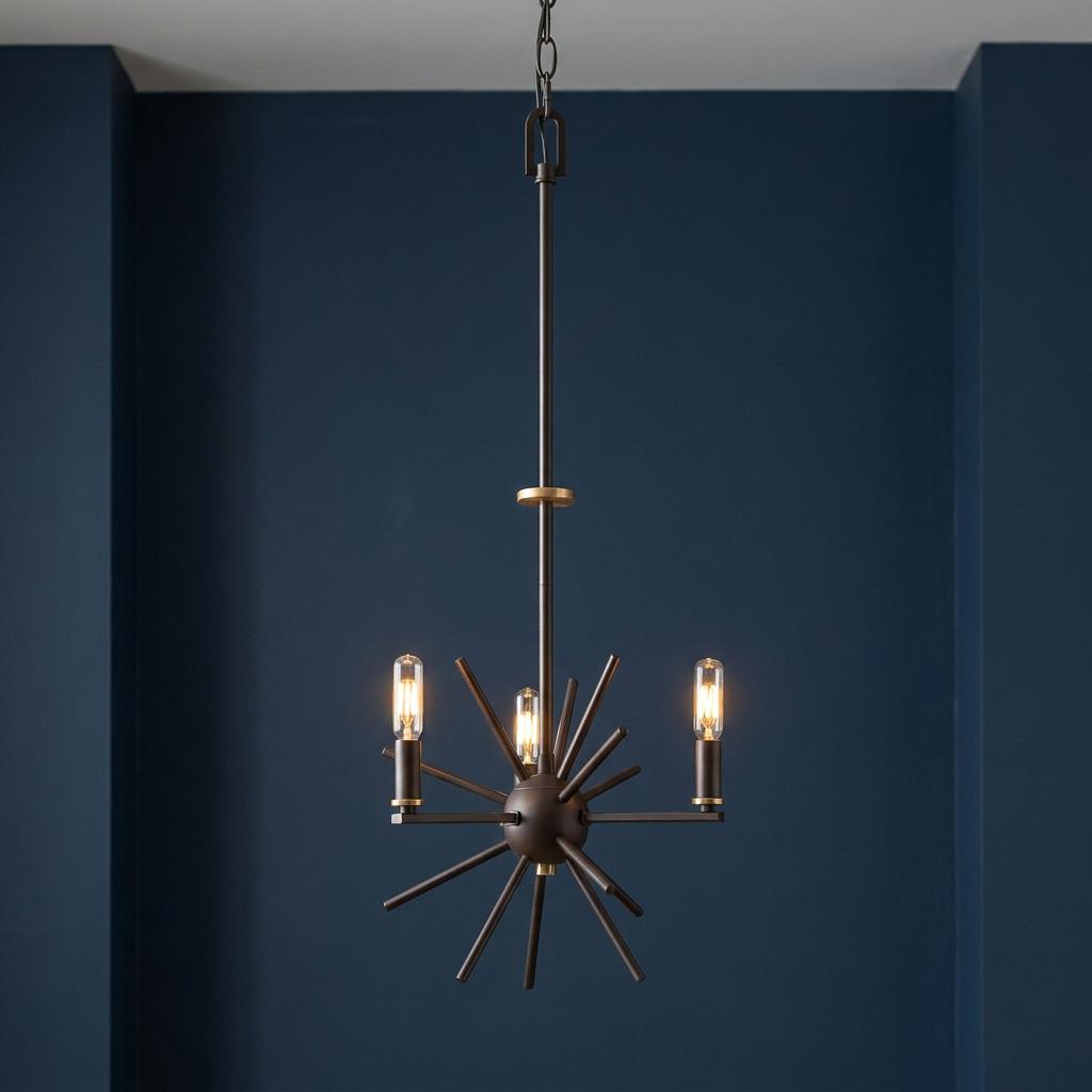 Western bronze 3-light starburst chandelier with filament bulbs hanging against a navy blue wall.