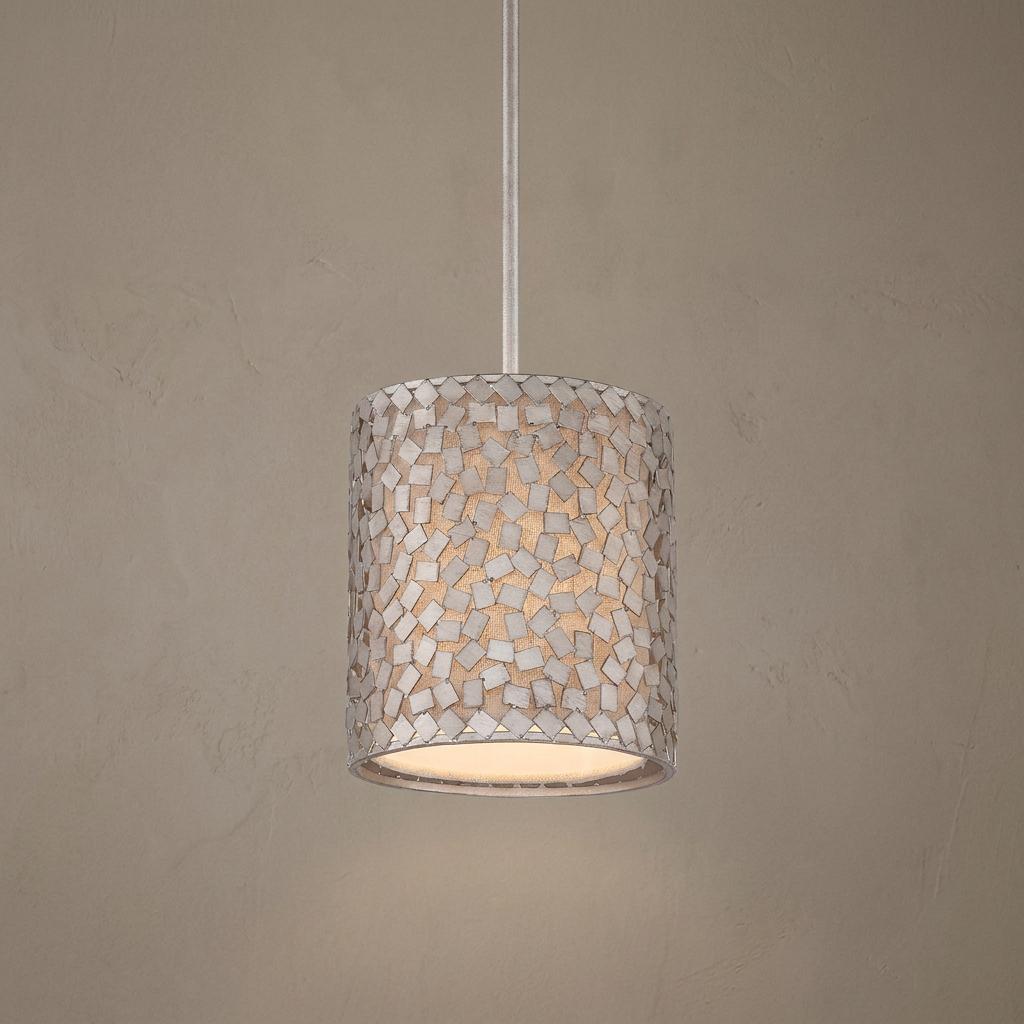 Cylindrical mini pendant light with an old silver metal confetti mosaic shade and warm interior illumination.
