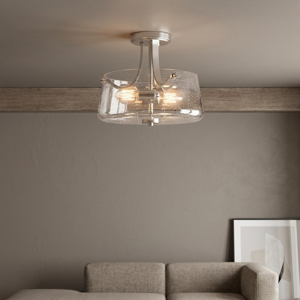 Quoizel Hollister semi-flush mount with a seeded glass shade and nickel finish in a modern living room setting.