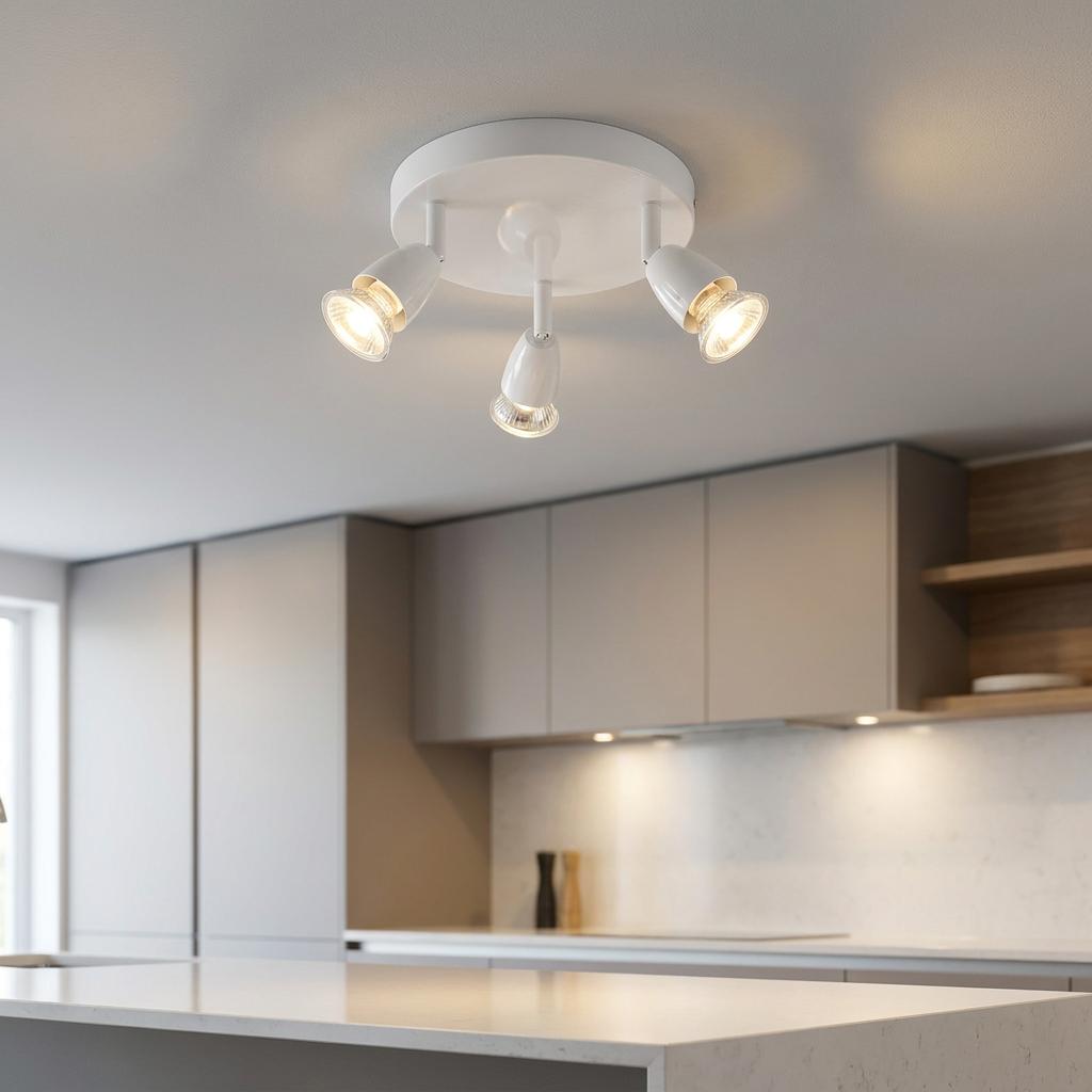 Saxby Amalfi 3-light gloss white ceiling spotlight illuminating a modern kitchen interior.
