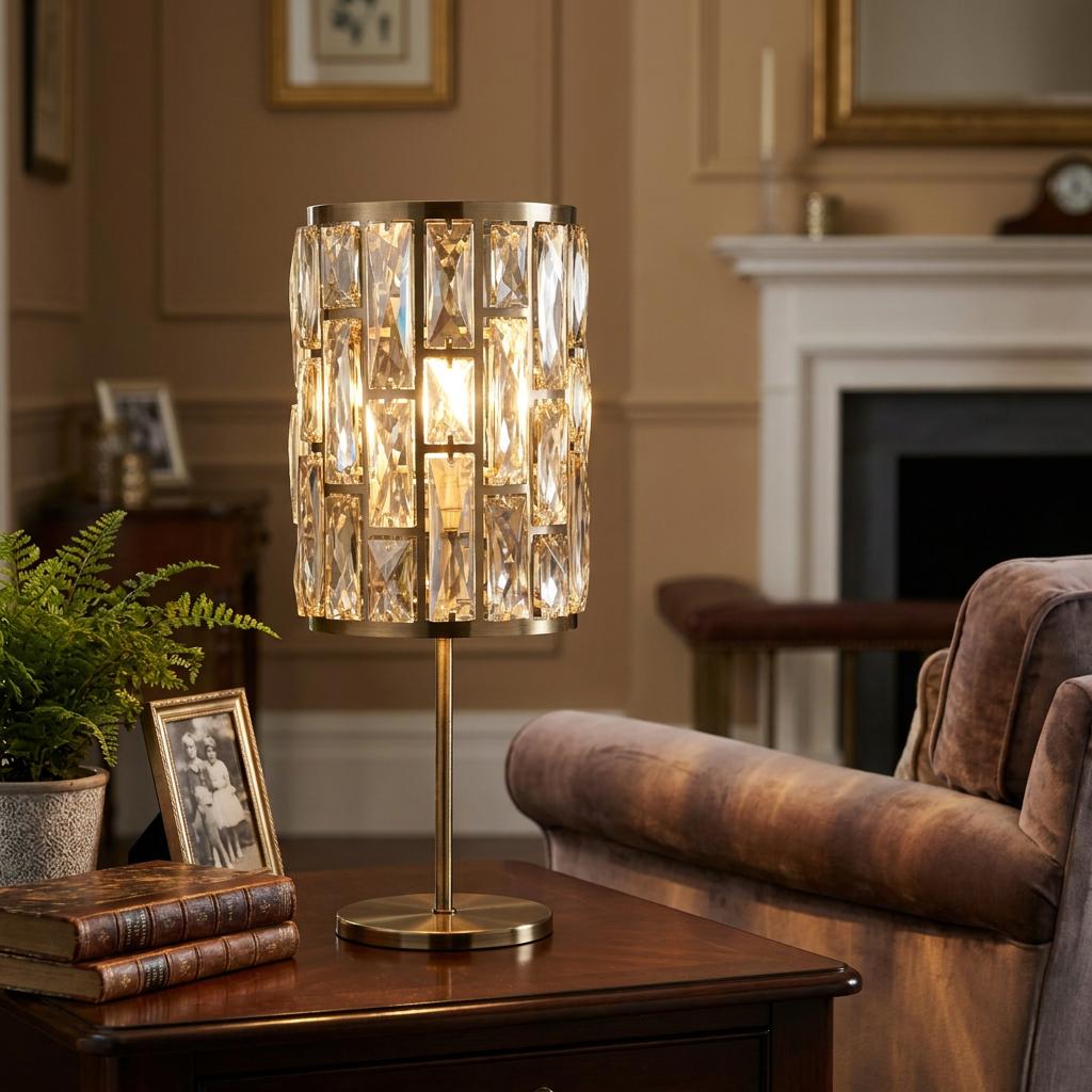 Elegant brass table lamp with a decorative crystal shade on a wooden table in a living room.