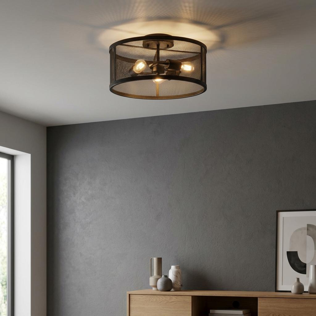 Searchlight Fishnet 3-light black mesh drum flush ceiling light illuminated in a modern room with a grey wall.