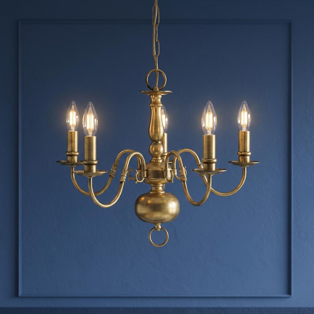 A Flemish five-light solid brass chandelier with candle bulbs and curved arms against a blue paneled wall.