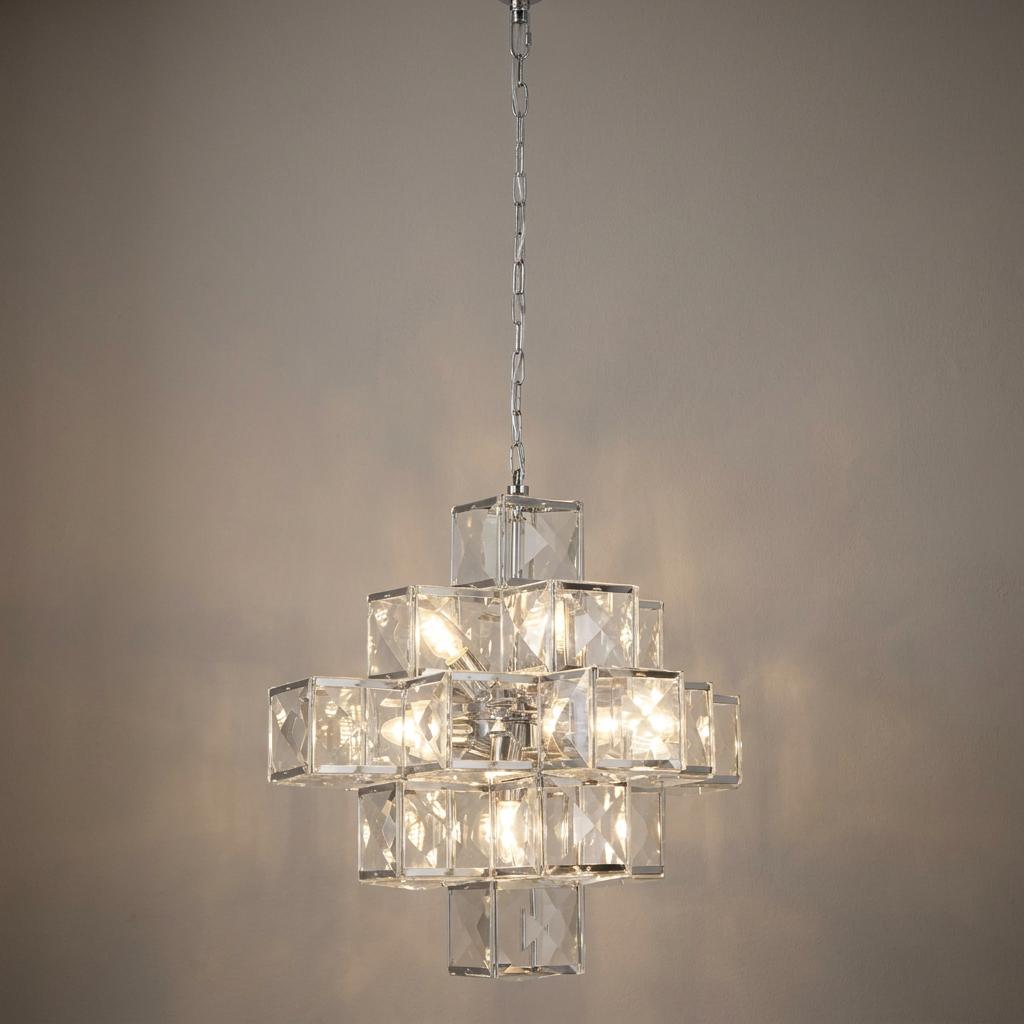 Modern chrome ceiling pendant with illuminated clear acrylic cubes in a tiered geometric design.