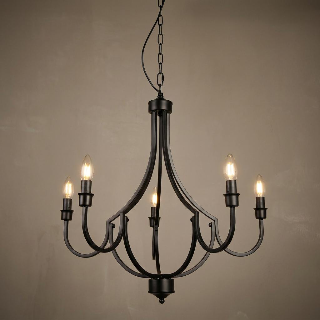 Five-light black metal chandelier with curved arms and glowing candle-style bulbs against a neutral wall.